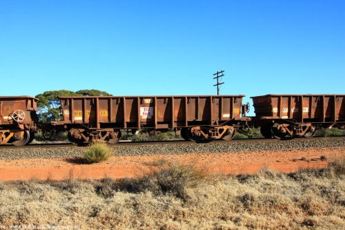 100731 02532
WO type iron ore waggon WO 31213 is one of a batch of eighty six built by WAGR Midland Workshops between 1967 and March 1968 with fleet number 109 for Koolyanobbing iron ore operations, with a 75 ton and 1018 ft³ capacity, on empty train 6418 at Binduli Triangle, 31st July 2010. This unit was converted to WOG for gypsum in late 1980s till 1990 then reclassed to WOS for superphosphate before being re-classed back to WO in 1994.
Keywords: WO-type;WO31213;WAGR-Midland-WS;