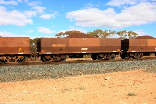 100731 02873
WOE type iron ore waggon WOE 31064 is one of a batch of one hundred and thirty built by Goninan WA between March and August 2001 with serial number 950092-054 and fleet number 650 for Koolyanobbing iron ore operations, on loaded train 7415 at Binduli Triangle, July 31, 2010.
Keywords: WOE-type;WOE31064;Goninan-WA;950092-054;