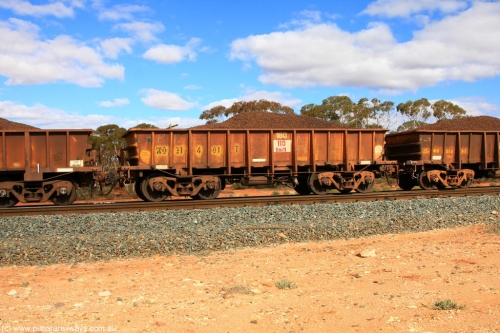 100731 02886
WO type iron ore waggon WO 31401 is leader of a batch of eleven replacement waggons built by WAGR Midland Workshops between 1970 and 1971 with fleet number 180 for Koolyanobbing iron ore operations, with a 75 ton and 1018 ft³ capacity, on loaded train 7415 at Binduli Triangle, 31st July 2010. This unit was converted to WOC for coal in 1986 till 1994 when it was re-classed back to WO.
Keywords: WO-type;WO31401;WAGR-Midland-WS;