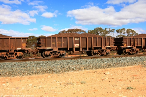 100731 02888
WOD type iron ore waggon WOD 31324 is one of a batch of sixty two built by Goninan WA between April and August 2000 with serial number 950086-012 and fleet number 502 for Koolyanobbing iron ore operations with a 75 ton capacity and a replacement for a WO type waggon number, for Portman Mining to cart their Koolyanobbing iron ore to Esperance, on loaded train 7415 at Binduli Triangle, July 31, 2010.
Keywords: WOD-type;WOD31324;Goninan-WA;950086-012;