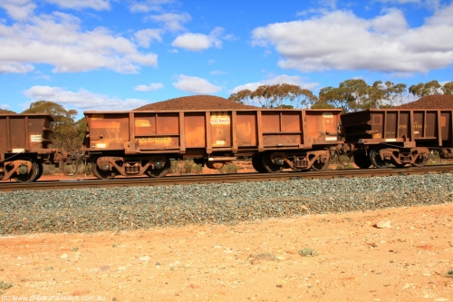 100731 02894
WOB type iron ore waggon WOB 31400 is one of a batch of twenty five built by Comeng WA between 1974 and 1975 and converted from Mt Newman high sided waggons by WAGR Midland Workshops with a capacity of 67 tons with fleet number 324 for Koolyanobbing iron ore operations. This waggon was also converted to a WSM type ballast hopper by re-fitting the cut down top section and having bottom discharge doors fitted, converted back to WOB in 1998, on loaded train 7415 at Binduli Triangle, July 31, 2010.
Keywords: WOB-type;WOB31400;Comeng-WA;WSM-type;Mt-Newman-Mining;