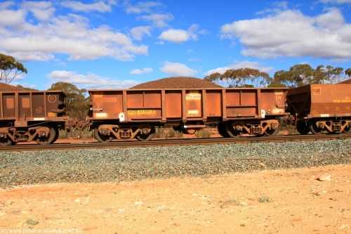 100731 02896
WOB type iron ore waggon WOB 31391 is one of a batch of twenty five built by Comeng WA between 1974 and 1975 and converted from Mt Newman high sided waggons by WAGR Midland Workshops with a capacity of 67 tons with fleet number 316 for Koolyanobbing iron ore operations. This waggon was also converted to a WSM type ballast hopper by re-fitting the cut down top section and having bottom discharge doors fitted, converted back to WOB in 1998, on loaded train 7415 at Binduli Triangle, 31st July 2010.
Keywords: WOB-type;WOB31391;Comeng-WA;WSM-type;Mt-Newman-Mining;
