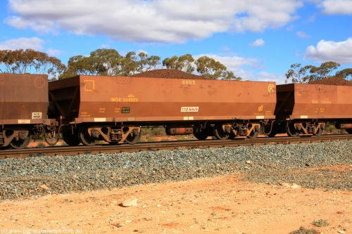 100731 02934
WOE type iron ore waggon WOE 33493 is one of a batch of one hundred and twenty eight built by United Group Rail WA between August 2008 and March 2009 with serial number 950211-033 and fleet number 8992 for Koolyanobbing iron ore operations, on loaded train 7415 at Binduli Triangle, July 31, 2010.
Keywords: WOE-type;WOE33493;United-Group-Rail-WA;950211-033;