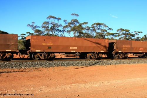 100731 03154
WOE type iron ore waggon WOE 33374 is one of a batch of one hundred and forty one built by United Goninan WA between November 2005 and April 2006 with serial number 950142-079 and fleet number 873 for Koolyanobbing iron ore operations, with a build date of 02/2006 and a revised load of 82.5 tonnes, empty train arriving at Binduli Triangle, 31st July 2010.
Keywords: WOE-type;WOE33374;United-Goninan-WA;950142-079;