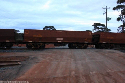 100822 6311
WOE type iron ore waggon WOE 33505 is one of a batch of one hundred and twenty eight built by United Group Rail WA between August 2008 and March 2009 with serial number 950211-045 and fleet number 9007 for Koolyanobbing iron ore operations, on empty train 1416 at Hampton, August 22, 2010.
Keywords: WOE-type;WOE33505;United-Group-Rail-WA;950211-045;