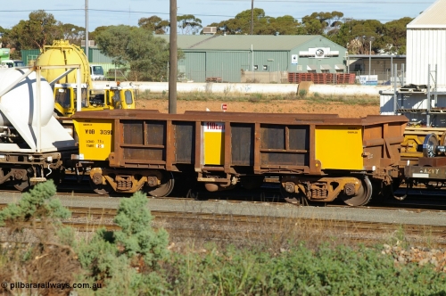 PD 12598
West Kalgoorlie, WOB type iron ore waggon WOB 31390 is one of a batch of twenty five built by Comeng WA between 1974 and 1975 and converted from Mt Newman high sided waggons by WAGR Midland Workshops with a capacity of 67 tons with fleet number 315 for Koolyanobbing iron ore operations and is one of the 15 converted to WSM type ballast hoppers by re-fitting the removed top section of the body and fitting bottom discharge doors. Converted back to WOB in 1997, fleet number not yet applied and having been fully re-sheeted and painted with the new angled lip applied to the top of the body.
Keywords: Peter-D-Image;WOB-type;WOB31390;Comeng-WA;WSM-type;Mt-Newman-Mining;