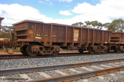 PD 12617
Binduli, WO type iron ore waggon WO 31407 is one of a batch of eleven replacement waggons built by WAGR Midland Workshops between 1970 and 1971 with fleet number 185 for Koolyanobbing iron ore operations, with a 75 ton and 1018 ft³ capacity. This unit was converted to WOC for coal in 1986 till 1994 when it was re-classed back to WO. Seen here with the body top lip also fitted.
Keywords: Peter-D-Image;WO-type;WO31407;WAGR-Midland-WS;