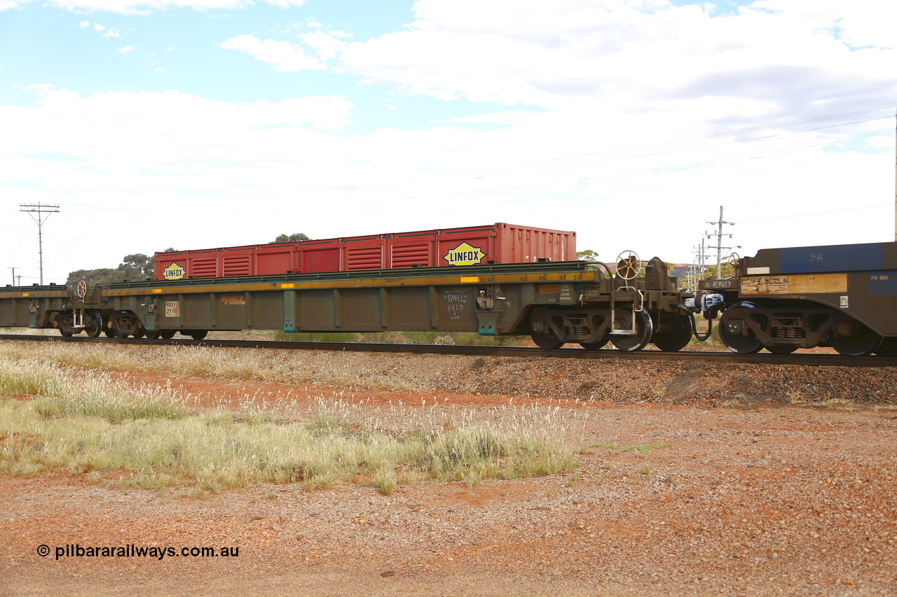 210407 9850
Parkeston, 2MP5 intermodal train, RRXY 2, platform 1 with a Linfox 40' LSDU half height side door container. The RRXY type 5-pack well waggon set is one of eleven built by Bradken Qld in 2002 for Toll from a Worley-Williams design.
Keywords: RRXY-type;RRXY2;Worley-Williams;Bradken-Rail-Qld;