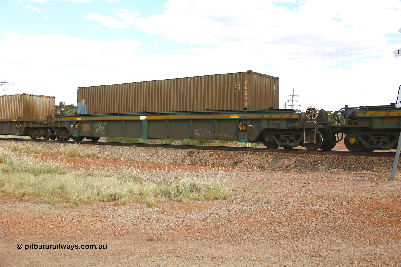 210407 9872
Parkeston, 2MP5 intermodal train, RRXY 9, platform 4 with an Austrans 40' 4EG1 type container AUSU 409608. The RRXY type 5-pack well waggon set is one of eleven built by Bradken Qld in 2002 for Toll from a Williams-Worley design.
Keywords: RRXY-type;RRXY9;Williams-Worley;Bradken-Rail-Qld;