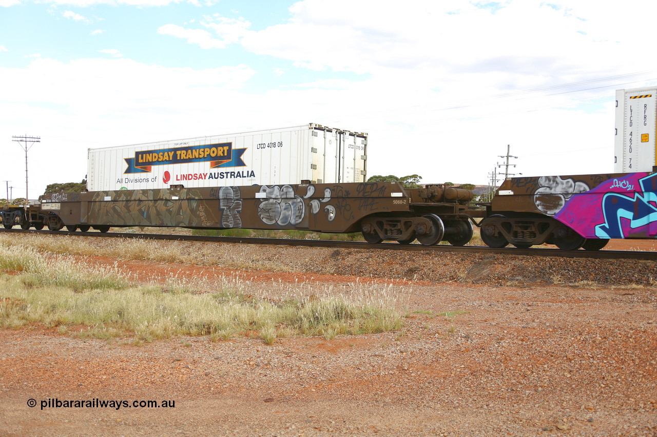 210407 9894
Parkeston, 2MP5 intermodal train, CQWY type well waggon CQWY 5060 well 2, the final set of well waggon pairs were built by Bluebird Rail Operations SA in a batch of sixty pairs in 2008 for CFCLA. Loaded with a 40' Lindsay Transport reefer LTCD 401806.
Keywords: CQWY-type;CQWY5060;CFCLA;Bluebird-Rail-Operations-SA;