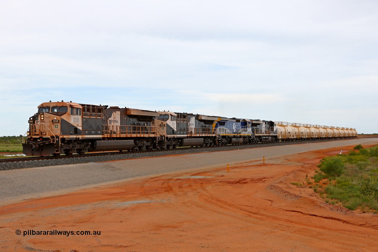 180117 1146
Great Northern Highway, 18 km grade crossing sees Roy Hill loaded fuel train with General Electric built ES44ACi units RHA 1018 serial 63829 leading RHA 1019, CFCLA lease unit Goninan ALCo to GE rebuild CM40-8M unit CD 4302 and RHA 1013 with eleven loaded fuel tank waggons. CD 4302 is the only unit powering as it was being tested. 17th January 2018.
Keywords: RHA-class;RHA1018;GE;ES44ACi;63829;