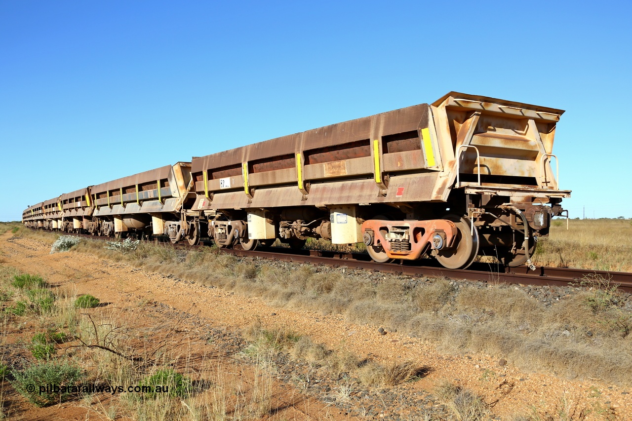 180527 1200
Pippingarra, near the 17 km on the former Goldsworthy line, BHP has stored some redundant service waggons, Difco side dumps, a couple of heavy weights and the old winch and crib waggons from the steel train. Looking east with a former GML short Difco side dump waggon on the end. 27th May 2018. [url=https://goo.gl/maps/duWQ1f8kqf92]GeoData[/url].
