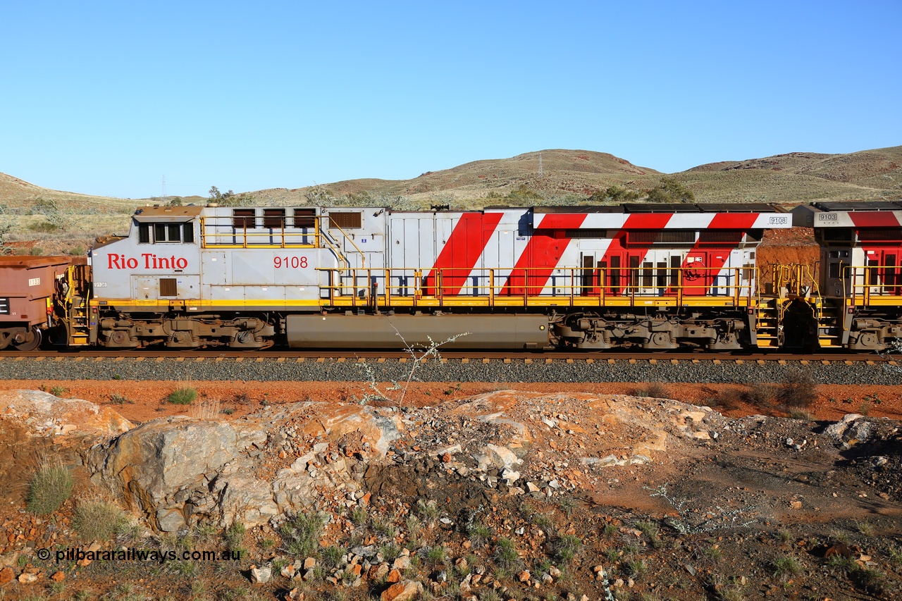 180616 1660
Cooya Pooya, 32 km on the Cape Lambert line, Rio Tinto loco 9108 with serial 62539 a GE Erie built GE model ES44ACi from the 2nd order in Rio Tinto Stripes livery side view, following a total loss of air, the train is tied down while the driver walks the consist. The train pulled a coupling around the 45 car position. 16th June 2018. [url=https://goo.gl/maps/ckyFypg4LAy]Geodata[/url]
Keywords: 9108;62539;GE;ES44ACi;Rio-Tinto-Stripes;