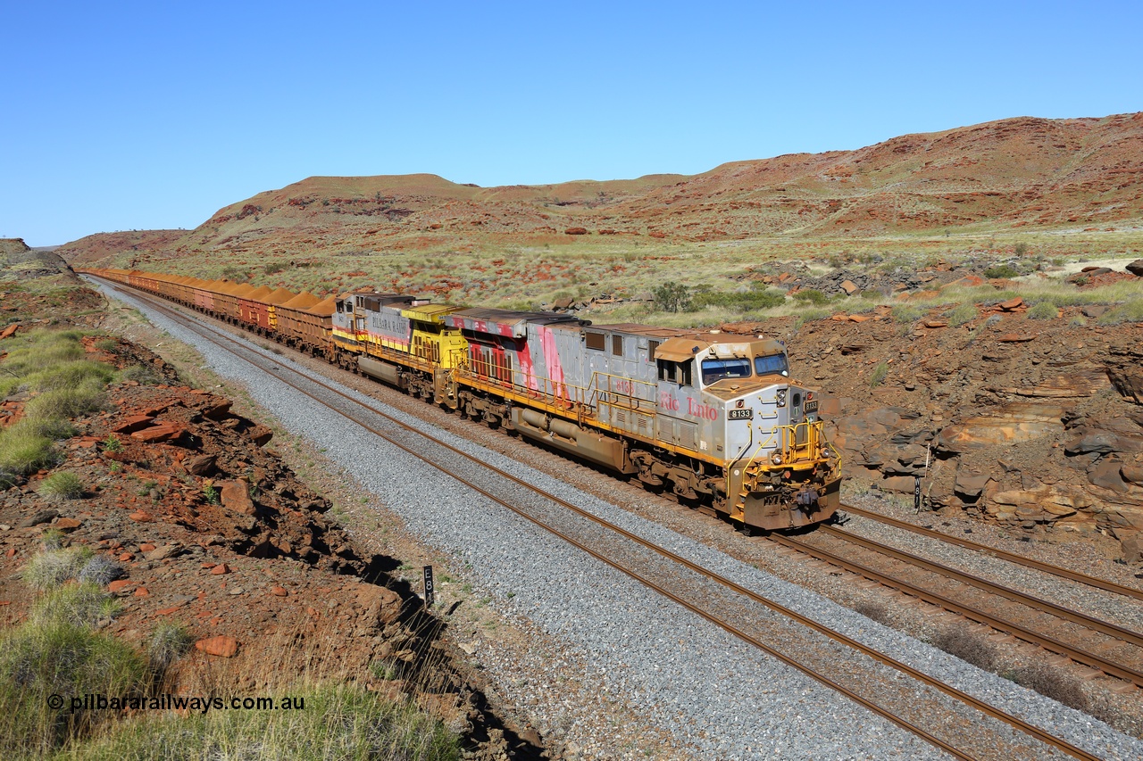 180616 1756
At the 81 km on the Tom Price West mainline, Rio Tinto loco 8133 with serial 59136 a GE Erie built GE model ES44DCi from the 2nd order in Rio Tinto Stripes livery leads Dash 9-44CW unit 9431 with a loaded train of S and C series waggons operating in AutoHaul™ as they approach Emu and then continue onto Dampier. 16th June, 2018. [url=https://goo.gl/maps/EkqHKXMxSHT2]GeoData[/url].
Keywords: 8133;59136;GE;ES44DCi;Rio-Tinto-Stripes;