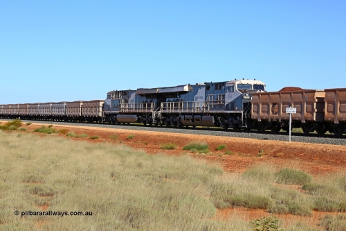 180615 1513
Indee Station road grade crossing 53.3 km, loaded Roy Hill mid-train units General Electric built ES44ACi model RHA 1014 serial 62586 and sister unit RHA 1004. [url=https://goo.gl/maps/teDNtwntmYR2]GeoData[/url]. 15th June 2018.
Keywords: RHA-class;RHA1014;ES44ACi;GE;62586;