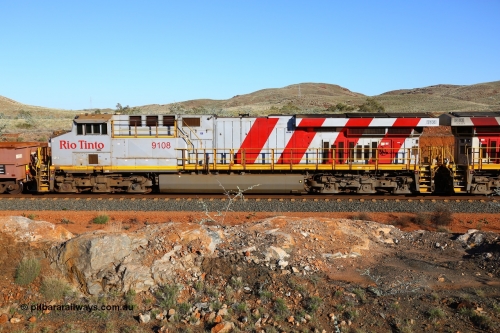 180616 1660
Cooya Pooya, 32 km on the Cape Lambert line, Rio Tinto loco 9108 with serial 62539 a GE Erie built GE model ES44ACi from the 2nd order in Rio Tinto Stripes livery side view, following a total loss of air, the train is tied down while the driver walks the consist. The train pulled a coupling around the 45 car position. 16th June 2018. [url=https://goo.gl/maps/ckyFypg4LAy]Geodata[/url]
Keywords: 9108;GE;ES44ACi;62539;Rio-Tinto-Stripes;