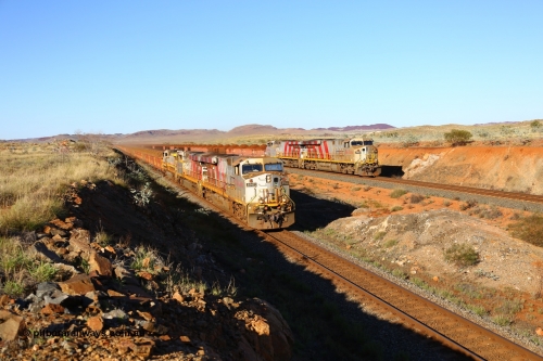 180616 1668
Cooya Pooya, at the 32 km on the Cape Lambert line a loaded HIY train on the East Mainline led by Rio Tinto loco 8142 with serial 58723 a GE Erie built GE model ES44DCi from the 3rd order in Rio Tinto Stripes livery as it powers past the disabled train stabled on the West Mainline with sister 8158 and Dash 9-44CW 9428 assisting 8142. 16th June 2018. [url=https://goo.gl/maps/LdE1Ly5DDHE2]GeoData[/url].
Toad Montgomery image.
Keywords: 8142;GE;ES44DCi;58723;Rio-Tinto-Stripes;