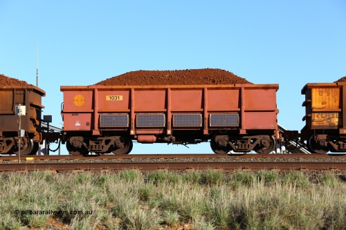 180616 1679
Cooya Pooya, instrumented ore waggon 1031, part of a second batch of extra 'J' waggons built by Bradken in September 2008 and painted rather than the plain steel finish. Solar panels adorn the waggon sides. 16th June 2018. [url=https://goo.gl/maps/PW31kLARES92]GeoData[/url].
Keywords: 1031;Bradken-NSW;
