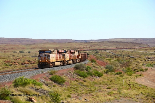 180616 1810
Emu Siding, an empty train from Cape Lambert powers upgrade away from Emu Siding up the 1.6 percent grade behind Rio Tinto loco 8149 with serial 58730 a GE Erie built GE model ES44DCi from the 3rd order in Rio Tinto Stripes livery and 8193 with Dash 9-44CW unit 7089 with a consist of S and C type waggons. 16th June 2018. [url=https://goo.gl/maps/M5Nc32gSiLy]GeoData[/url].
Keywords: 8149;GE;ES44DCi;58730;Rio-Tinto-Stripes;