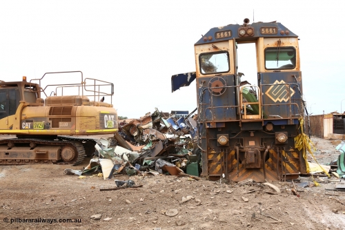 160128 00876
Wedgefield, Sims Metal Yard, the almost unmarked front of Goninan rebuilt GE model CM40-8M unit 5661, serial 8412-06, builders no. 94-152 is surrounded by the twisted scrap that earlier formed the rest of the locomotive.
Keywords: 5661;Goninan;GE;CM40-8M;8412-06/94-152;rebuild;Comeng-NSW;ALCo;M636C;5488;C6084-4;