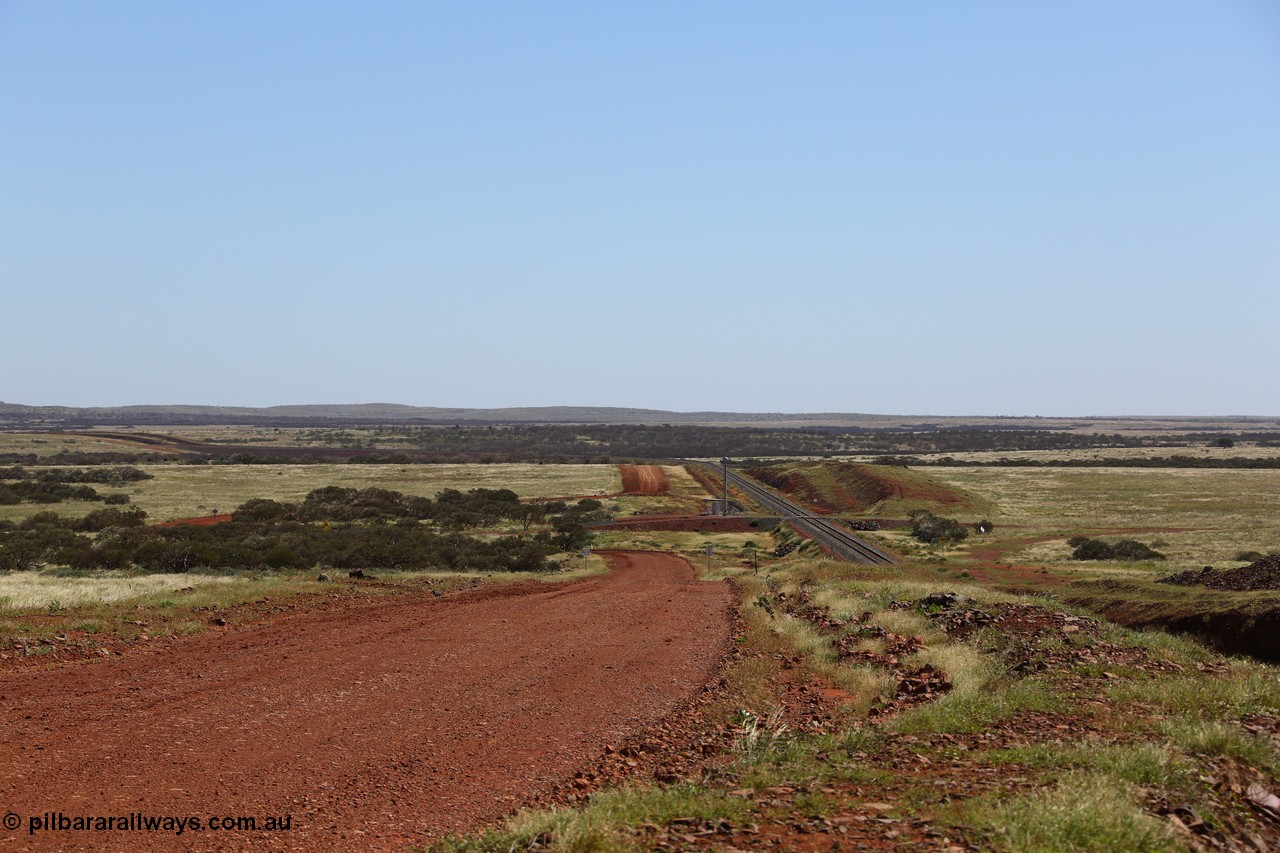 150505 7953
FMG Solomon Line, looking west with cutting to the right, 227.5 km grade crossing in the distance, track is curving away to the left in the background. Geodata: [url=https://goo.gl/maps/fkHYybyjbU42] -22.0200283 118.5880600 [/url].
