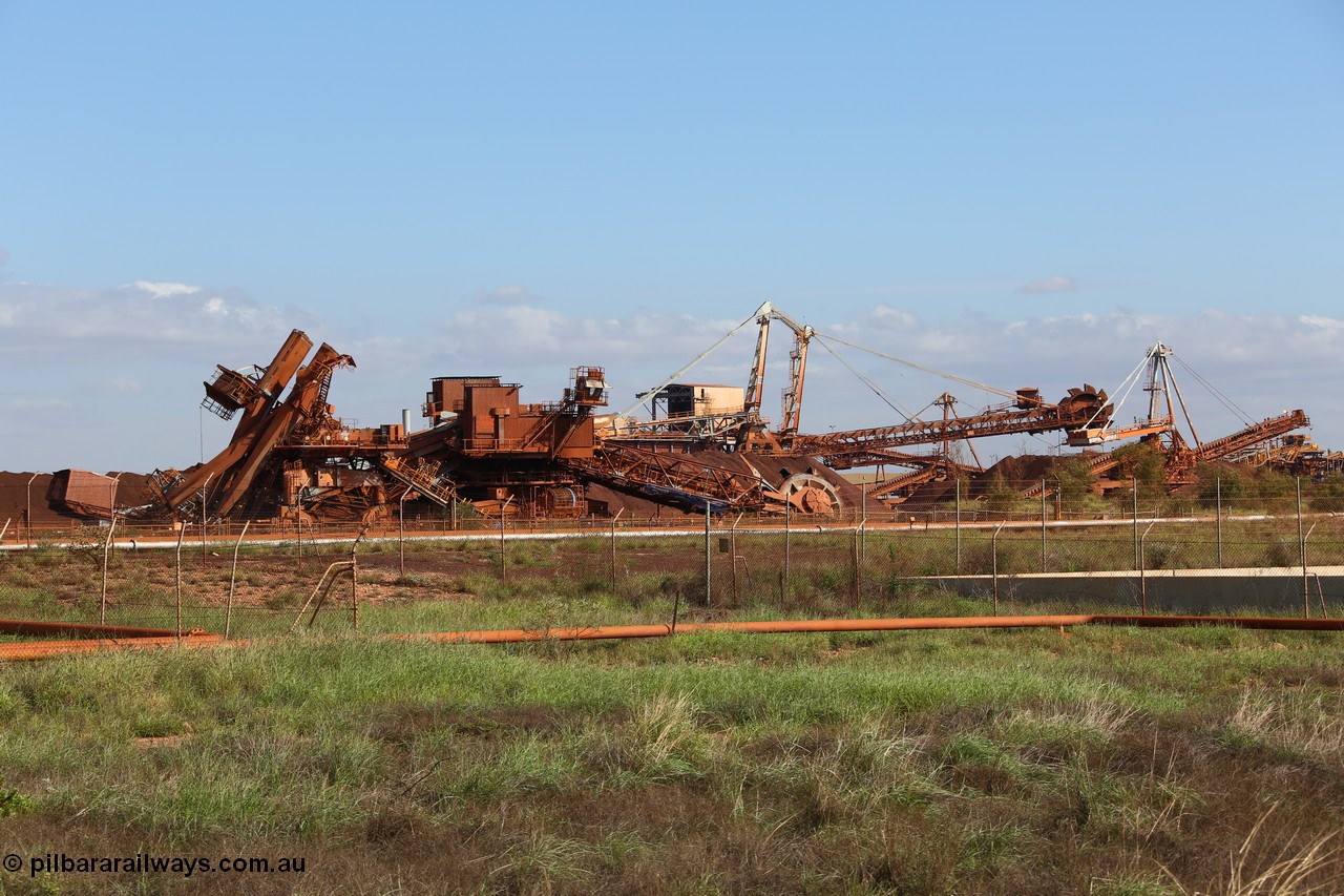 150518 8149
BHP Iron Ore old and retired ore stacker #4 and bucket wheel reclaimer #4 are blown apart to aid in the scrapping process.
