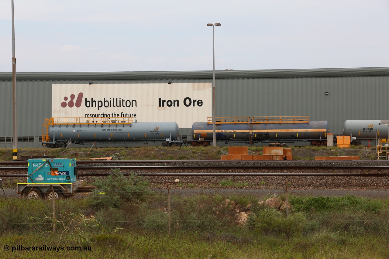 150523 8205
Nelson Point Yard, parked beside the Locomotive Service Shop, new style BHP Billiton diesel fuel tank waggon 0035 with safety slogan 'Take time to work safety', total capacity of 117 m3 for a nominal capacity of 113 m3 built in China by CNR - QRRS and fitted with ECPB coupled to original fuel tank waggon number 0013 built by Comeng with a 113649 litre capacity.
Keywords: CNR-QRRS-China;BHP-tank-waggon;Comeng-NSW;