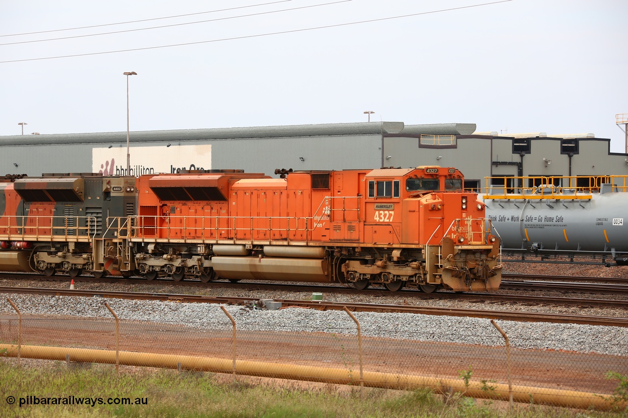 150523 8238
Nelson Point Yard, BHP Billiton SD70ACe unit leads a rake towards the dumpers. Lead unit 4327 'Hamersley' is from an order originally being built by Electro-Motive, London Ontario for BNSF, an US class 1 railroad, but BHP secured 10 of them during construction, this unit 4327 serial no. 20066862-056 was destined to be BNSF 9185 before coming to BHP.
