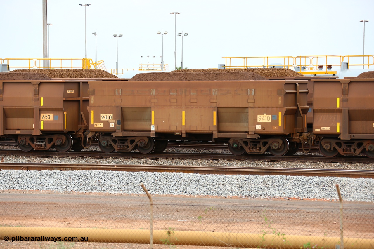 150523 8243
Nelson Point Yard, loaded ore waggon 9410, a smooth sided style waggon built by Bradken with 5Cr12Ti stainless steel which does away with the need to paint the waggon interiors to prevent wear.
Keywords: Bradken-NSW;BHP-ore-waggon;