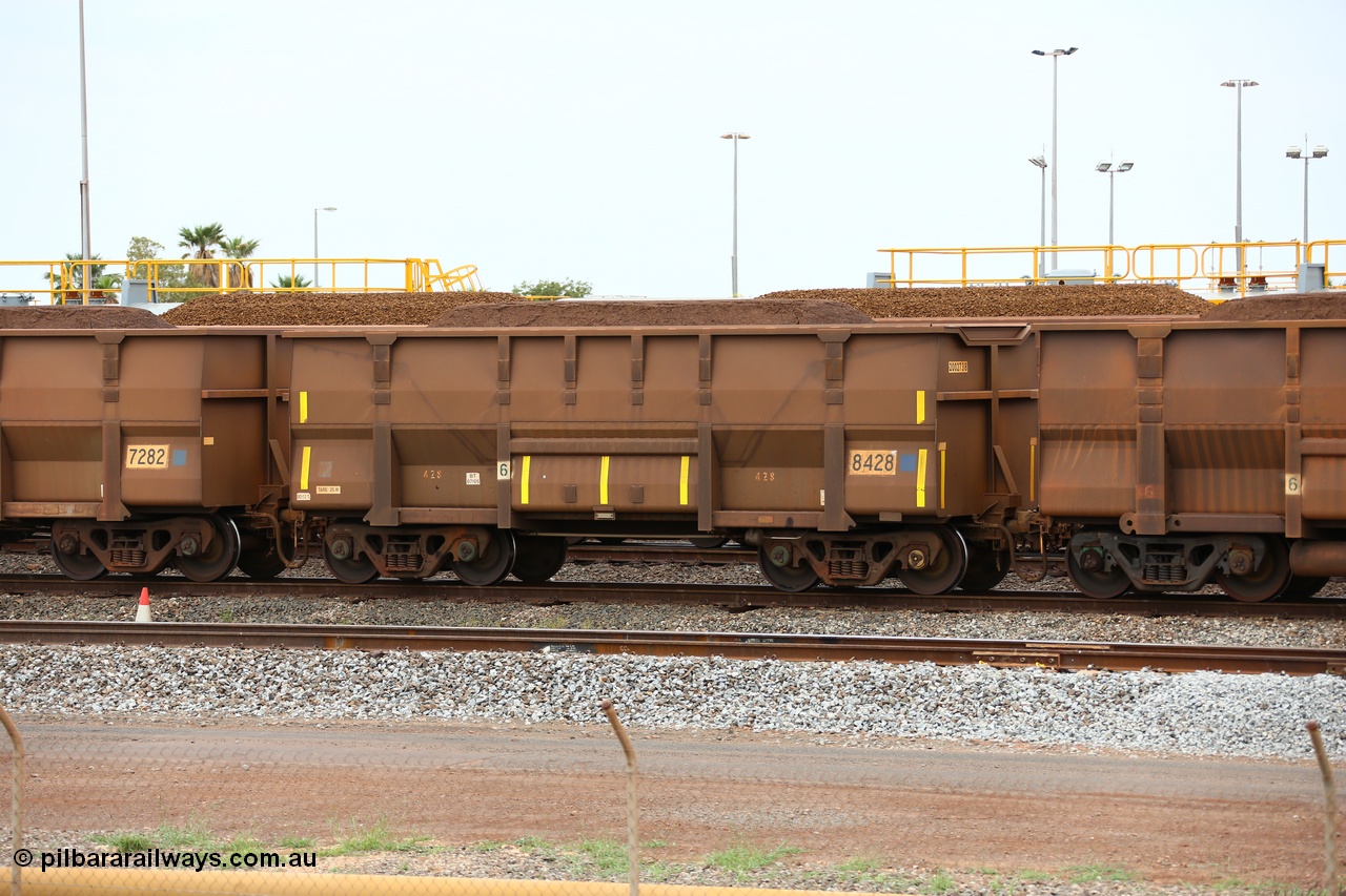 150523 8248
Nelson Point Yard, loaded ore waggon 8428, a Golynx style waggon built by Goninan in 05-2005 serial no. 950141-008 and asset number of 2002738 out of 5Cr12Ti stainless steel which does away with the need to paint the waggon interiors to prevent wear. This waggon was originally a bottom discharge hopper for use on the Goldsworthy Line prior to the unloader at Finucane Island being replaced with a rotary cell dumper.
Keywords: Goninan-Golynx;BHP-ore-waggon;