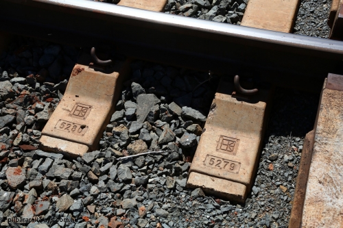 150505 7949
FMG Solomon Line track - sleeper detail. The logo stamped in the sleeper is for Austrak the manufacturer and the running number for the quality control.
