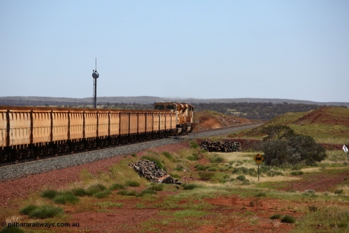 150505 7982
FMG Solomon Line, bank engines Progress Rail EMD SD70ACe/LCi unit 716 serial 20118693-008 and EMD SD90MAC unit 901 serial 976833-1, this unit has been repowered with an 16-710G3 prime mover, cross the 227.5 km grade crossing as they shove the loaded train upgrade at an increasing speed as the front of the train has topped the grade. Geodata: [url=https://goo.gl/maps/gSzXJkmY3ux] -22.0187117 118.5850933 [/url].
Keywords: FMG-716;Progress-Rail-Muncie-USA;EMD;SD70ACe/LCi;FMG-901;SD90MAC-H2;