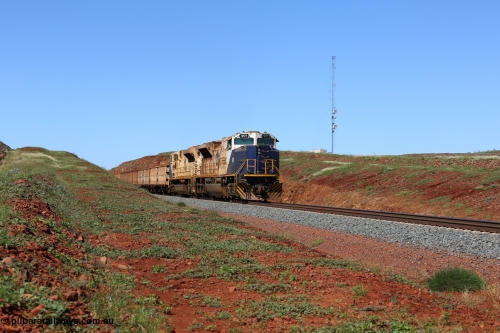 150505 7990
FMG Solomon Line, bank engines Progress Rail EMD SD70ACe/LCi unit 716 serial 20118693-008 and EMD SD90MAC unit 901 serial 976833-1, this unit has been repowered with an 16-710G3 prime mover, at the 227 km as they bank the loaded train upgrade into the cutting, the train speed is now increasing as the front of the train has topped the grade. Geodata: [url=https://goo.gl/maps/gSzXJkmY3ux] -22.0187117 118.5850933 [/url].
Keywords: FMG-716;Progress-Rail-Muncie-USA;EMD;SD70ACe/LCi;FMG-901;SD90MAC-H2;