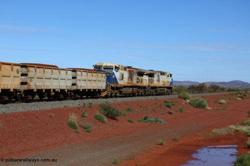 150507 8050
FMG Solomon Line, bank engines, a pair of General Electric Dash 9-44CW locomotives, units 005 serial 58182 and 006 serial 58183 assist a loaded train at the 278.291 km grade crossing. Geodata: [url=https://goo.gl/maps/VJdq8gsQ9ro]-22.1620833 118.1272300 [/url].
Keywords: FMG-006;GE;Dash-9-44CW;58183;FMG-005;58182;