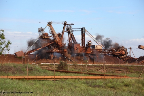 150518 8120
BHP Iron Ore old and retired ore stacker #4 and bucket wheel reclaimer #4 are blown apart to aid in the scrapping process.
