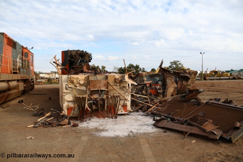 150522 8186
Wedgefield, Sims Metal yard, the first of BHP Billiton Dash 8 locos to be scrapped, CM40-8 5646 serial 8244-11/92-135 one of a pair of new Goninan WA built CM40-8 units has already had most of the hood removed and the V16 7FDL prime mover is visible, sister unit 5647 sits along side with the same fate coming up next. Full details of these units past lives [url=http://www.pilbararailways.com.au/bhp/loco/bhpb-roster.php] can be seen here [/url].
Keywords: 5646;Goninan;GE;CM40-8;8244-11/92-135;