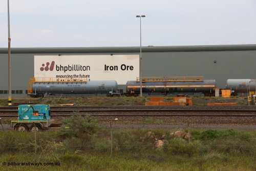 150523 8205
Nelson Point Yard, parked beside the Locomotive Service Shop, new style BHP Billiton diesel fuel tank waggon 0035 with safety slogan 'Take time to work safety', total capacity of 117 m3 for a nominal capacity of 113 m3 built in China by CNR - QRRS and fitted with ECPB coupled to original fuel tank waggon number 0013 built by Comeng with a 113649 litre capacity.
Keywords: CNR-QRRS-China;BHP-tank-waggon;Comeng-NSW;