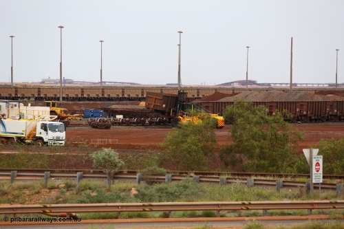 150523 8232
Nelson Point Yard, I Area, waggon scrapping by Sims Metal, a fork lift carries waggon no. 3340, one of 350 waggons built in Romania of which only about 60 made it into service, the rest rusting away in a caged embargo area out on the Broome Road until they were scrapped some years ago. There is a connection with these waggons and Lang Hancock and his former mine McCamey's Monster, now known as Jimblebar.
Keywords: Astra-Vagoane-Arad-Romania;BHP-ore-waggon;
