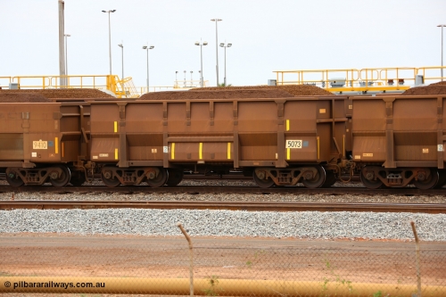 150523 8242
Nelson Point Yard, loaded ore waggon 5073, a Golynx style waggon built by Goninan, serial no. 950126-114 in 2004 with 5Cr12Ti stainless steel which does away with the need to paint the waggon interiors to prevent wear.
Keywords: Goninan-WA;Golynx;BHP-ore-waggon;
