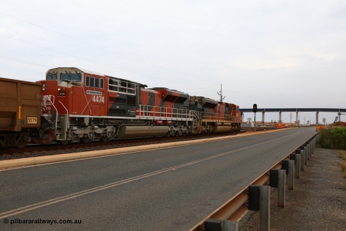 150523 8270
Finucane Island, empty train heading back to Boodarie behind Progress Rail EMD SD70ACe unit 4379 serial 20108424-006 and a newly arrived and named sibling 4474 'Raymond White' serial 20148001-007. View of 4474 looking south across grade crossing and new Roy Hill conveyor and road bridge. Geodata: [url=https://goo.gl/maps/3oDrc9JAS762] -20.3341700 118.5504083 [/url].
Keywords: 4474;Progress-Rail-Muncie-USA;EMD;SD70ACe/LCi;20148001-007;