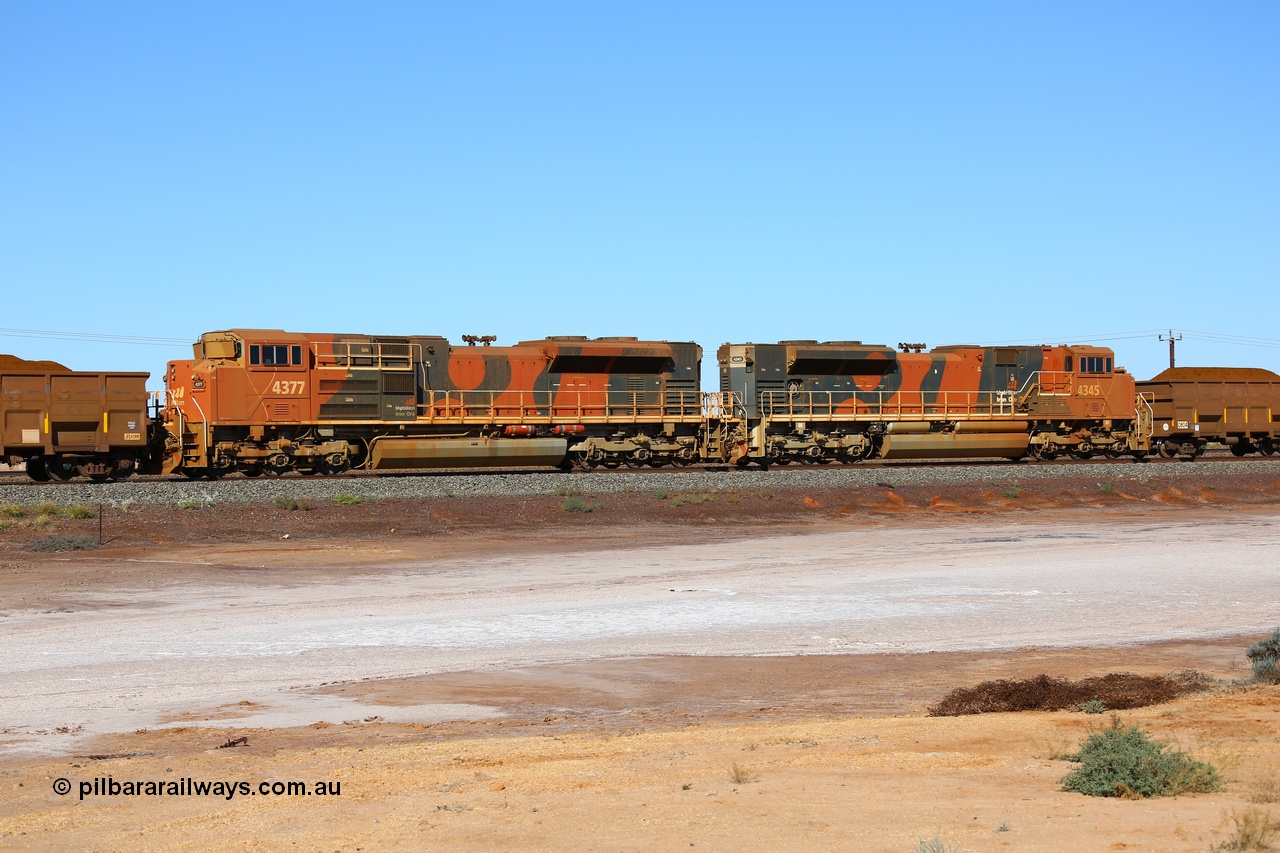 170726 9430
Redbank, a loaded BHP iron ore train from Yandi arrives into Nelson Point yard on the west mainline with mid-train remote units built by Progress Rail as SD70ACe unit 4377 serial 20108424-004 leading an SD70ACe/LC unit 4345. 26th July 2017.
Keywords: 4377;Progress-Rail-Muncie-USA;EMD;SD70ACe;20108424-004;