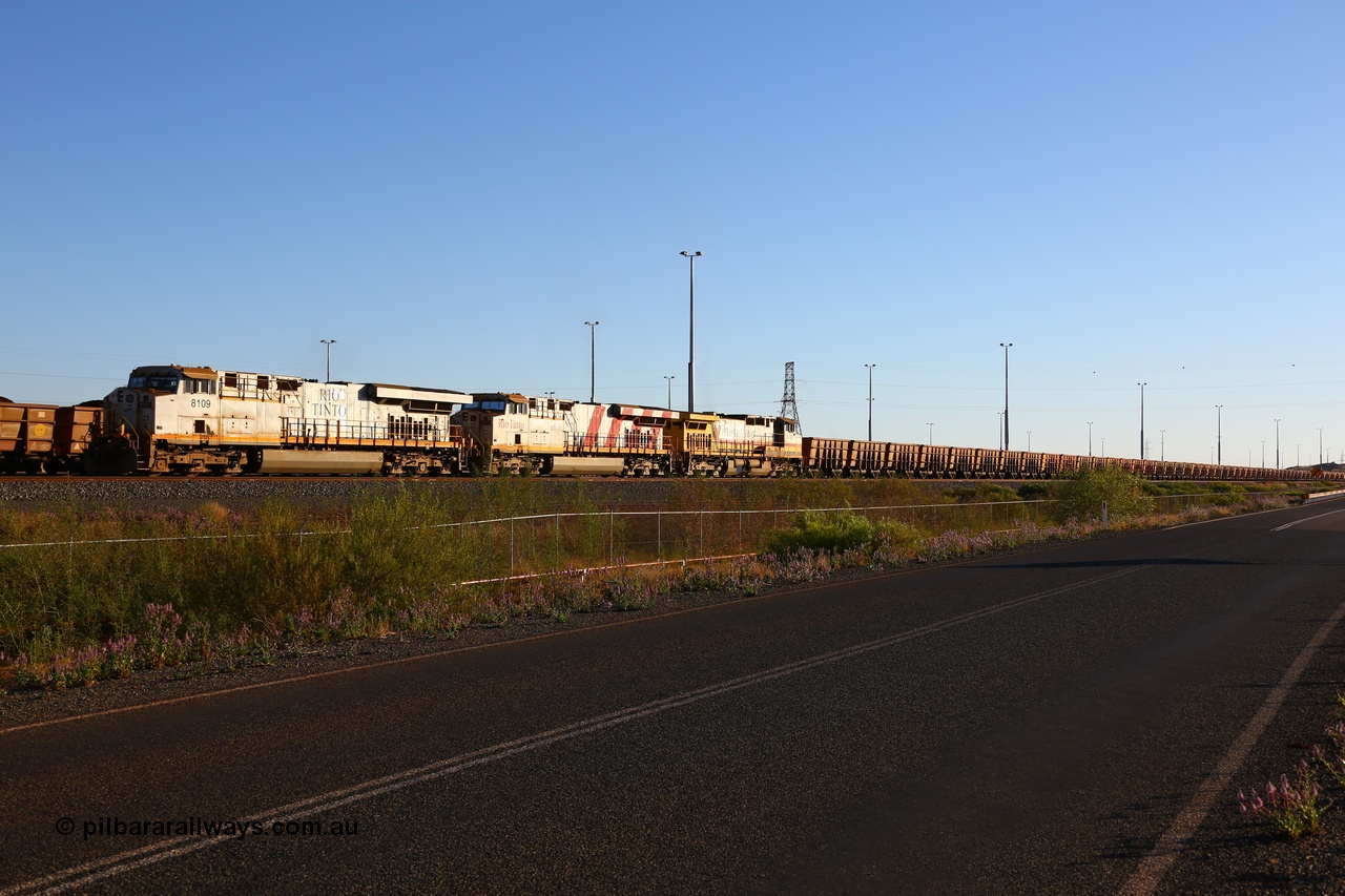 170728 09682
Cape Lambert South Yard, and empty train await departure time behind Rio Tinto 8109 serial 58005 a General Electric built ES44DCi unit with sister 8178 in Rio stripes and stablemate 9433. 28th July 2017. [url=https://goo.gl/maps/2nTd3LLrfBR2]GeoData[/url].
Keywords: 8109;GE;ES44DCi;58005;