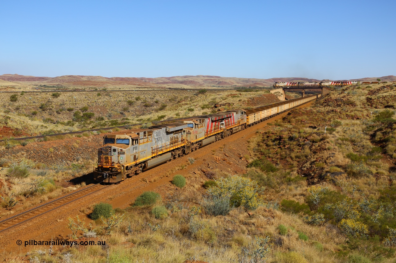 170728 09855
Western Creek - Emu area, Rio Tinto's General Electric built ES44DCi class leader 8100 serial 57996 leads two sister units, in 8176 and 8143 both in the later Rio Tinto stripe livery, with a loaded train running down from Emu Siding on the line to Dampier. The disabled Mesa A train is still on the bridge, the line to the left of the loaded is the Robe River Western Creek - Emu interconnecting line. 28th July 2017. [url=https://goo.gl/maps/vvUWXEgppNM2]GeoData[/url].
Keywords: 8100;57996;GE;ES44DCi;