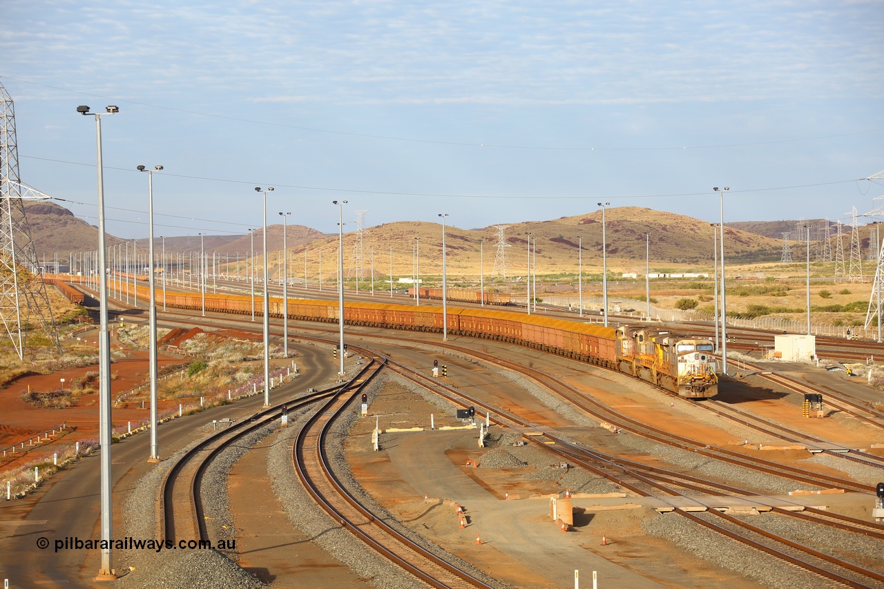 170729 0076
Cape Lambert South yard, a loaded train heads towards car dumper 5 behind General Electric built ES44DCi unit 8103 serial 57999 in original Rio Tinto silver with a Dash 9-44CW unit 7076 and sister ES44DCi unit 8129 in the later Rio Tinto stripe livery. 29th July 2017. [url=https://goo.gl/maps/zQ62JNaib6J2]GeoData[/url].
Keywords: 8103;57999;GE;ES44DCi;
