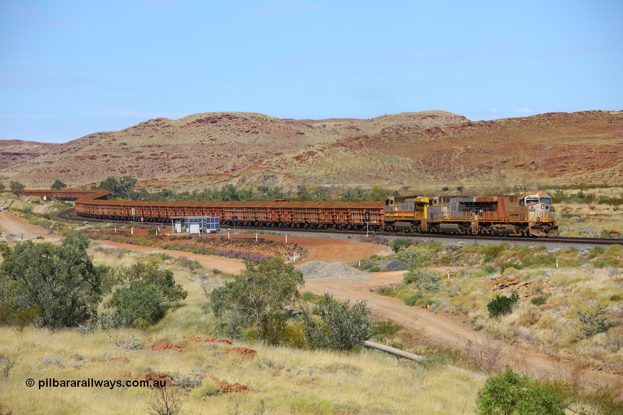 170729 0145
Emu Siding, a loaded Rio Tinto train rolls down grade past the signals at the 74.8 km West Mainline behind Rio Tinto stripe liveried General Electric built ES44DCi unit 8194 serial 61853 and plain silver sister unit 8111 and Dash 9-44CW stablemate 7055 as they head to the Cape Lambert port for unloading. 29th July 2017. [url=https://goo.gl/maps/ad5sT7twQUq]GeoData[/url]
Keywords: 8194;61853;GE;ES44DCi;
