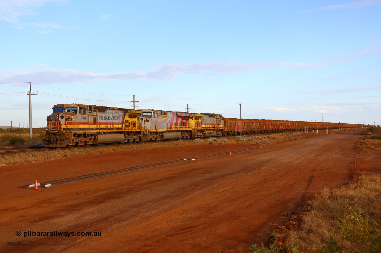 170729 0415
Seven Mile yard, a loaded train departs the yard for Parker Point dumpers behind General Electric built Dash 9-44CW unit 7044 serial 57095 in Pilbara Iron livery with HI reporting marks, ES44DCi unit 8134 in Rio Tinto stripes and another Dash 9-44CW unit 9407 in Pilbara Rail livery with Robe reporting marks. 29th July 2017. [url=https://goo.gl/maps/nSD3qYLHE462]GeoData[/url].
Keywords: 7044;57095;GE;Dash-9-44CW;