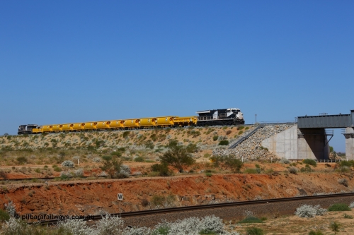170727 9627
Woodstock Siding, a Roy Hill ballast train works north as it is about to cross BHP's Woodstock running lines, General Electric Erie built model ES44ACi unit RHA 1006 serial 62578 leads a side dump, ten ballast hoppers and a ballast plough with a sister unit on the rear. 27th July 2017. [url=https://goo.gl/maps/peEKeGz9sKS2]GeoData[/url].
Keywords: RHA-class;RHA1006;GE;ES44ACi;62578;
