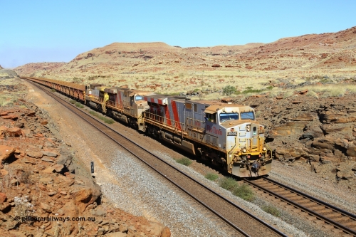 170728 09805
Emu Siding, a loaded train rolls down grade at the 81 km West Mainline behind Rio Tinto stripe liveried General Electric built ES44DCi unit 8144 serial 58725 and sister and final unit 8199 and a Dash 9-44CW stablemate 9403. 28th July 2017. [url=https://goo.gl/maps/h82NfgWLwnq]GeoData[/url].
Keywords: 8144;GE;ES44DCi;58725;