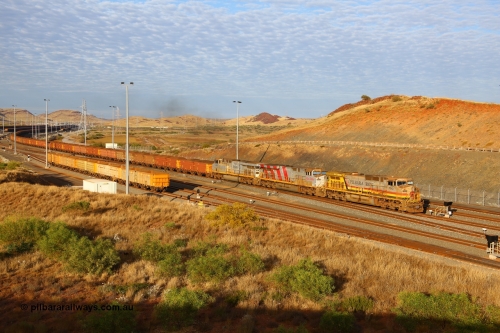 170729 0065
Cape Lambert South yard, a loaded train heads towards car dumper 7 behind General Electric built Dash 9-44CW unit 7043 serial 57094 wearing Pilbara Iron livery with HI reporting marks and two General Electric built ES44DCi units 8153 and 8107. 29th July 2017. [url=https://goo.gl/maps/oF6KMPRRAgx]GeoData[/url].
Keywords: 7043;GE;Dash-9-44CW;57094;HI-Pilbara-Iron;