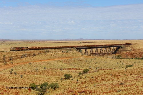 170729 0172
Fortescue River Bridge on the Robe River line at the 115.8 km, a loaded Deepdale train heading for Cape Lambert behind the standard motive power for this line, double General Electric built ES44ACi units, 9114 serial 62545 and sister unit 9101 serial 61939 run over the largest rail bridge in the Pilbara. 29th July 2017. [url=https://goo.gl/maps/urXsiFNXfiz]GeoData[/url].
Keywords: 9114;GE;ES44ACi;62545;